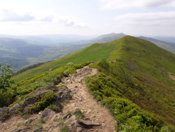 Scenic view of valley against sky