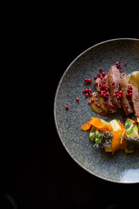Beautifully laid out salad on a plate with meat