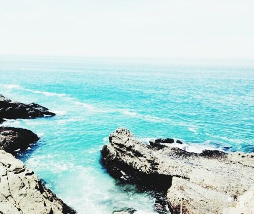 sea, horizon over water, water, scenics, tranquil scene, beauty in nature, tranquility, rock - object, nature, blue, rock formation, beach, idyllic, shore, rock, seascape, sky, clear sky, cliff, coastline