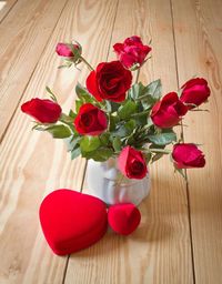 Close-up of roses in vase on table