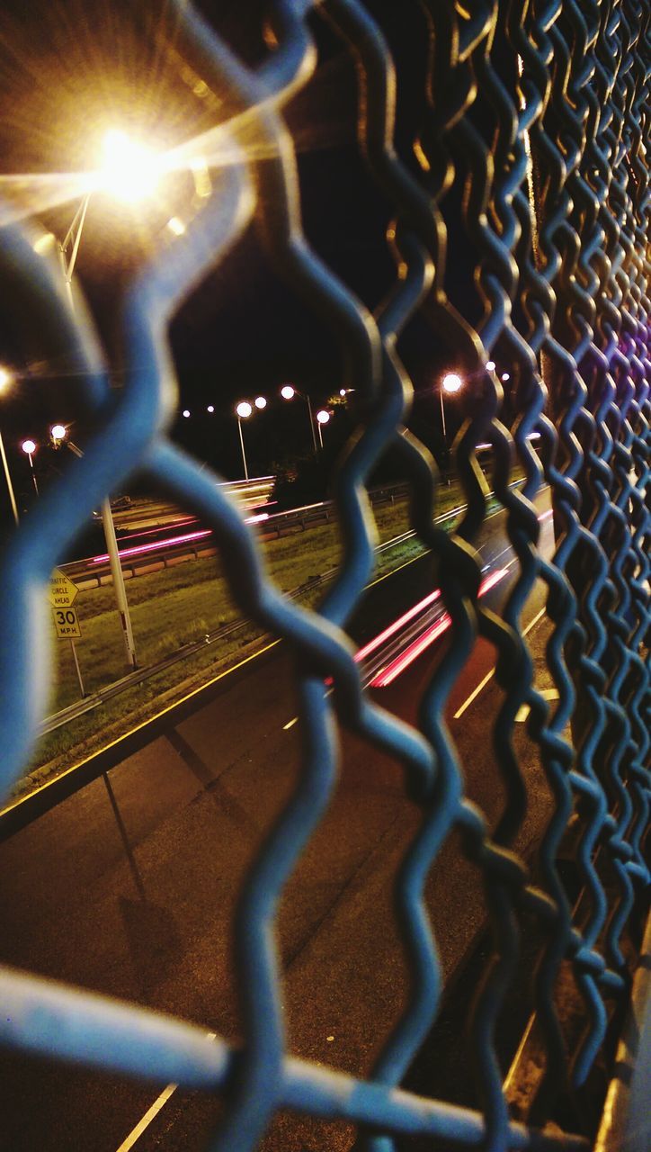 metal, metallic, illuminated, night, indoors, pattern, close-up, security, full frame, safety, protection, metal grate, backgrounds, fence, no people, focus on foreground, chainlink fence, connection, built structure