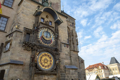 Low angle view of clock tower against sky