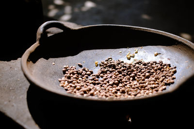 Sunlight falling on coffee beans in container