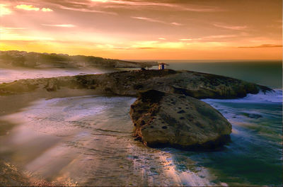 Scenic view of beach during sunset