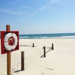 Scenic view of sea against blue sky