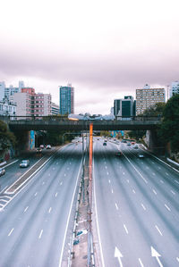 High angle view of highway by street against sky