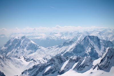 Scenic view of snowcapped mountains against sky