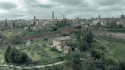 High angle view of buildings in city against sky