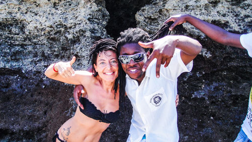 Rear view of woman standing on field