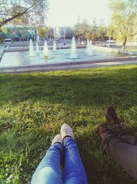 Low section of shoes on grass