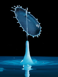 Close-up of water splashing on black background