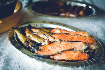 High angle view of fish in plate on table