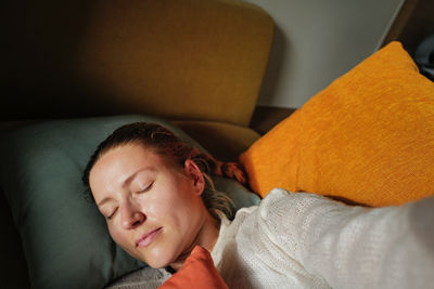 Woman relaxing on the colorful pillows