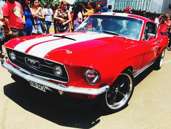 Red vintage car on road