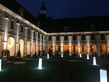 View of illuminated building against sky