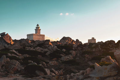 View of lighthouse against buildings