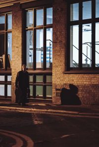 Man seen through window