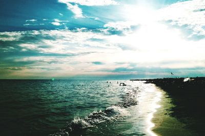 Scenic view of calm sea against cloudy sky