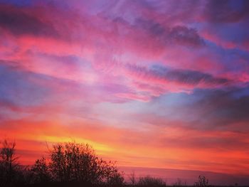 Low angle view of cloudy sky at sunset