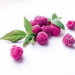 Close-up of fruits against white background