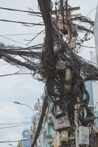 Close-up of electricity pylon against sky