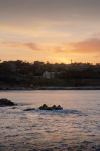 Scenic view of sea against sky during sunset