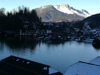 Scenic view of lake and mountains against sky