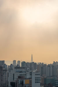 Cityscape against sky during sunset