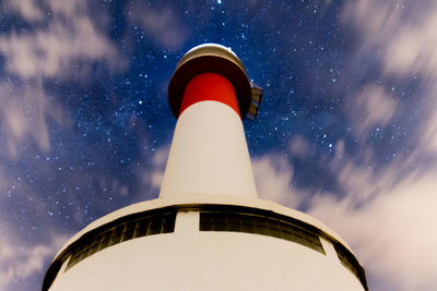 Low angle view of far del fangar lighthouse against sky at night