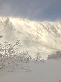 Scenic view of snow covered landscape against sky