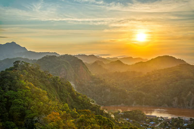 Scenic view of mountains against sky during sunset