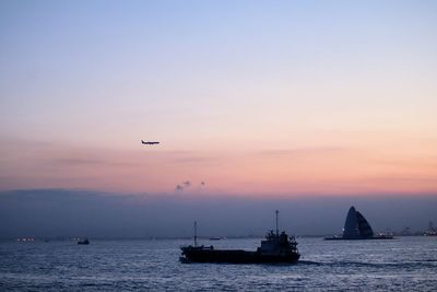 Scenic view of sea against sky during sunset