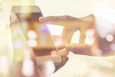 Close-up of hand holding smart phone