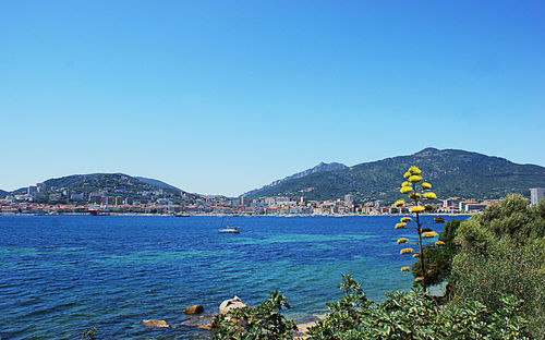 Scenic view of sea against clear blue sky