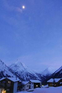 Scenic view of snow covered mountains against sky