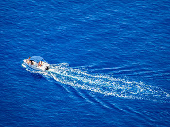 High angle view of ship sailing in sea