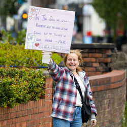 Woman standing against the wall