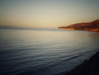 Scenic view of sea against sky at sunset