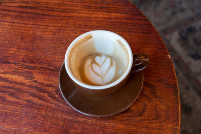 High angle view of cappuccino on table