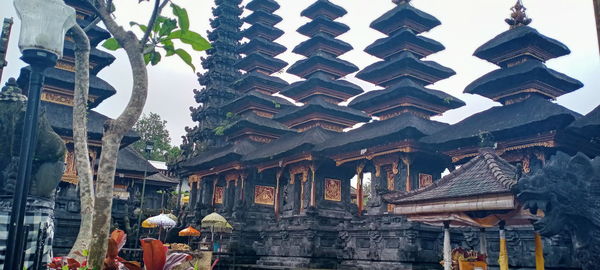 Low angle view of temple against building