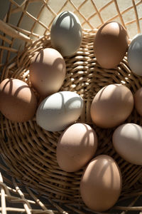 Basket of natural brown and bluish chicken eggs from local farmer's market