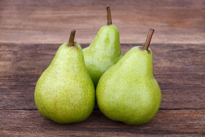 Close-up of green fruits on table