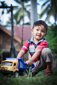 Portrait of cute boy toy car