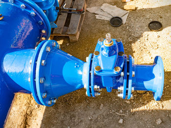 Close-up of blue pipes on land