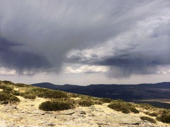 View of landscape against cloudy sky