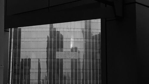 Reflection of building on glass window