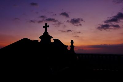 Silhouette of building at sunset