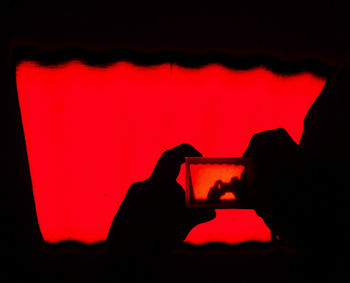 Close-up of red light against white wall