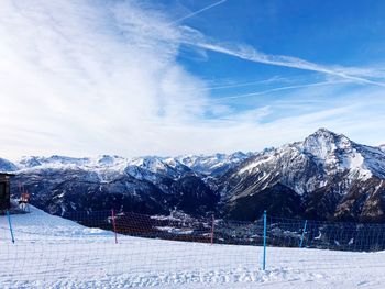 Scenic view of snowcapped mountains against sky