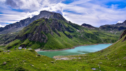 Scenic view of lake and mountains against sky